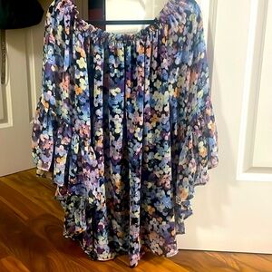 Floral dress can be worn off the shoulders as well as on